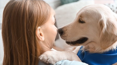 How can dogs support children with autism?